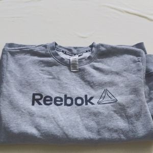 A medium sized grey Reebok sweater